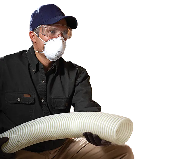 Insulation technician installing commercial attic insulation for energy efficiency.