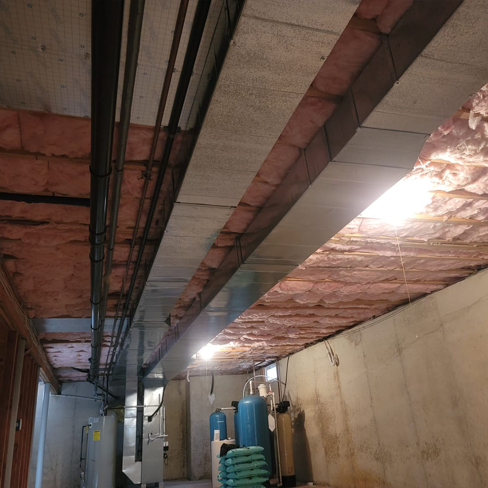 Image of a refurbished basement following the installation of mineral wool on the ceiling