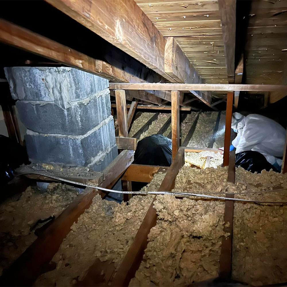 Removal of old insulation in an attic