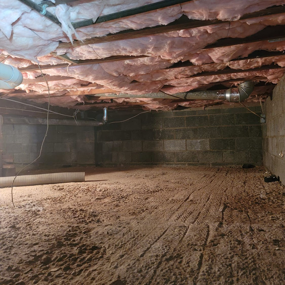 Image of a crawl space with brand new insulation